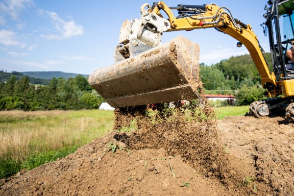 Mini Excavator bucket closeup during work on construction site